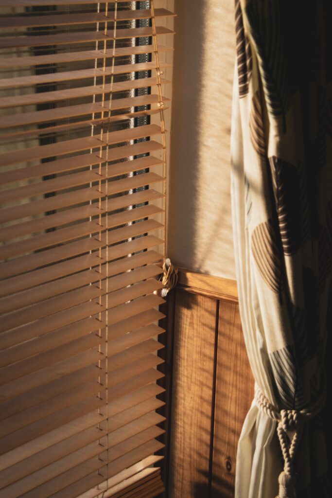 Wooden Venetian blinds are a type of window covering made from horizontal slats of wood, 