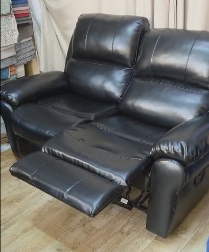 Here is open the footrest of the recliner sofa.